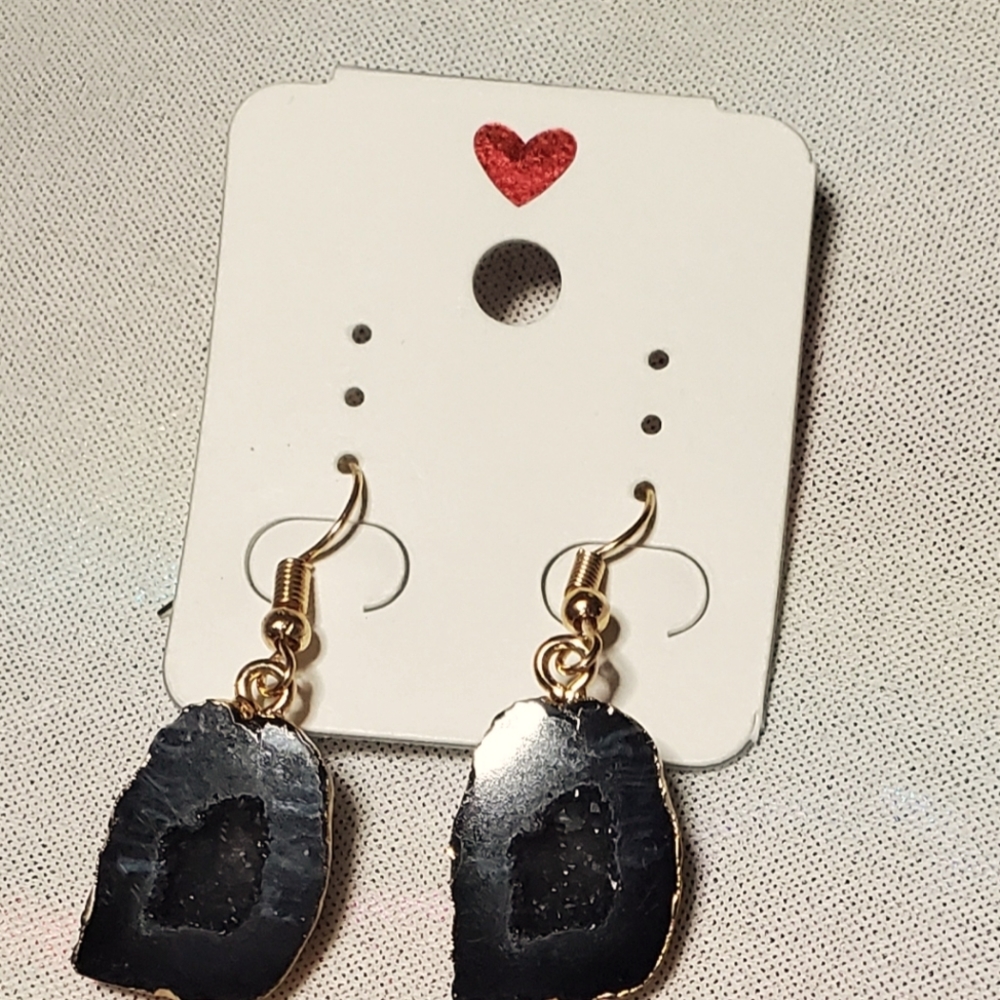 Black and gold acrylic fish hook fashion earrings.